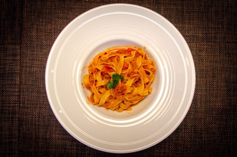 Fresh tagliatelle in tomato sauce, Italian pasta dish at Pizza on Fire Phuket