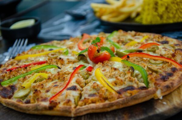 Pizza with colourful bell pepper toppings at Metro Fast Food, Patong, Phuket