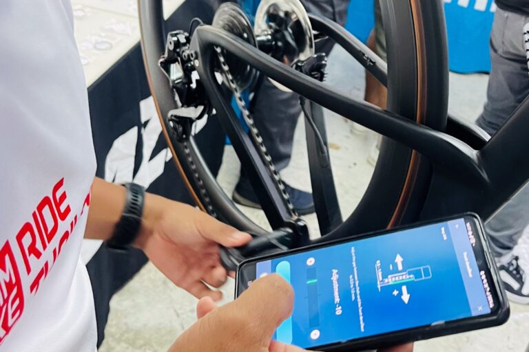 Adjusting e-bike settings via smartphone app, Siam Bike Tours Phuket