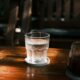 Glass of iced water on a wooden table