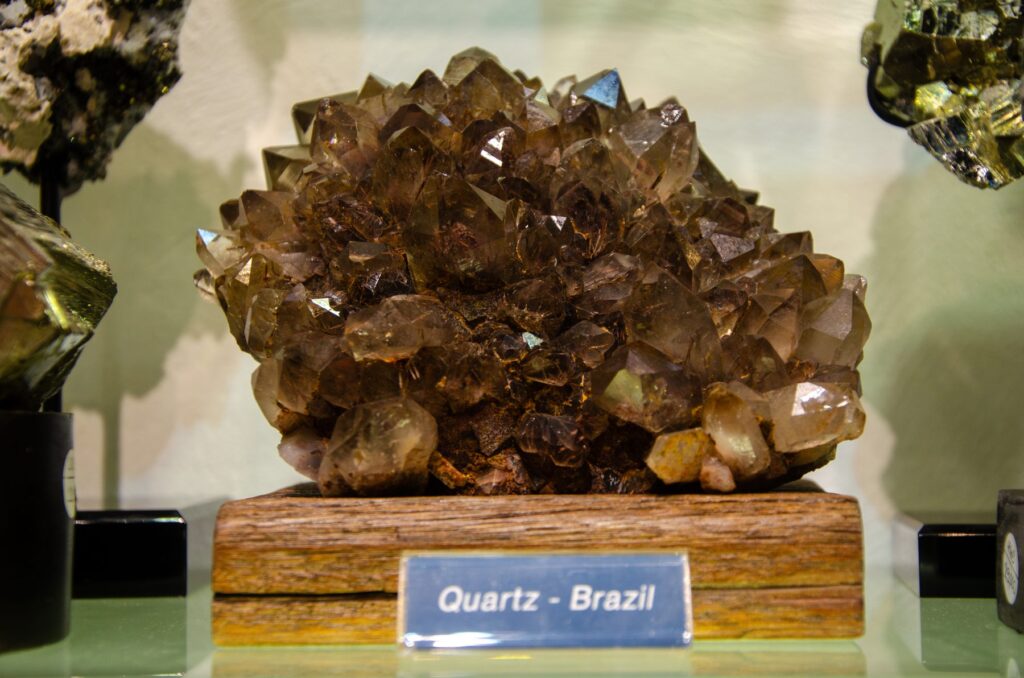 How to choose a crystal starts with origin, shown here on a brown quartz cluster labeled Brazil