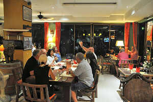 Guests sharing a meal together at Le Celtique restaurant, Rawai Phuket