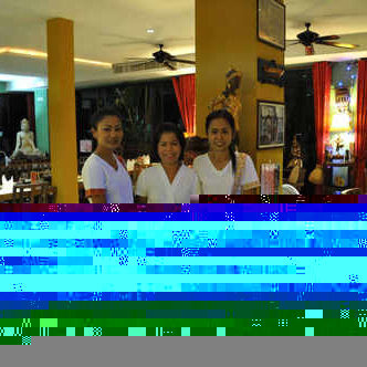 Le Celtique restaurant staff in traditional Thai dress, Rawai Phuket