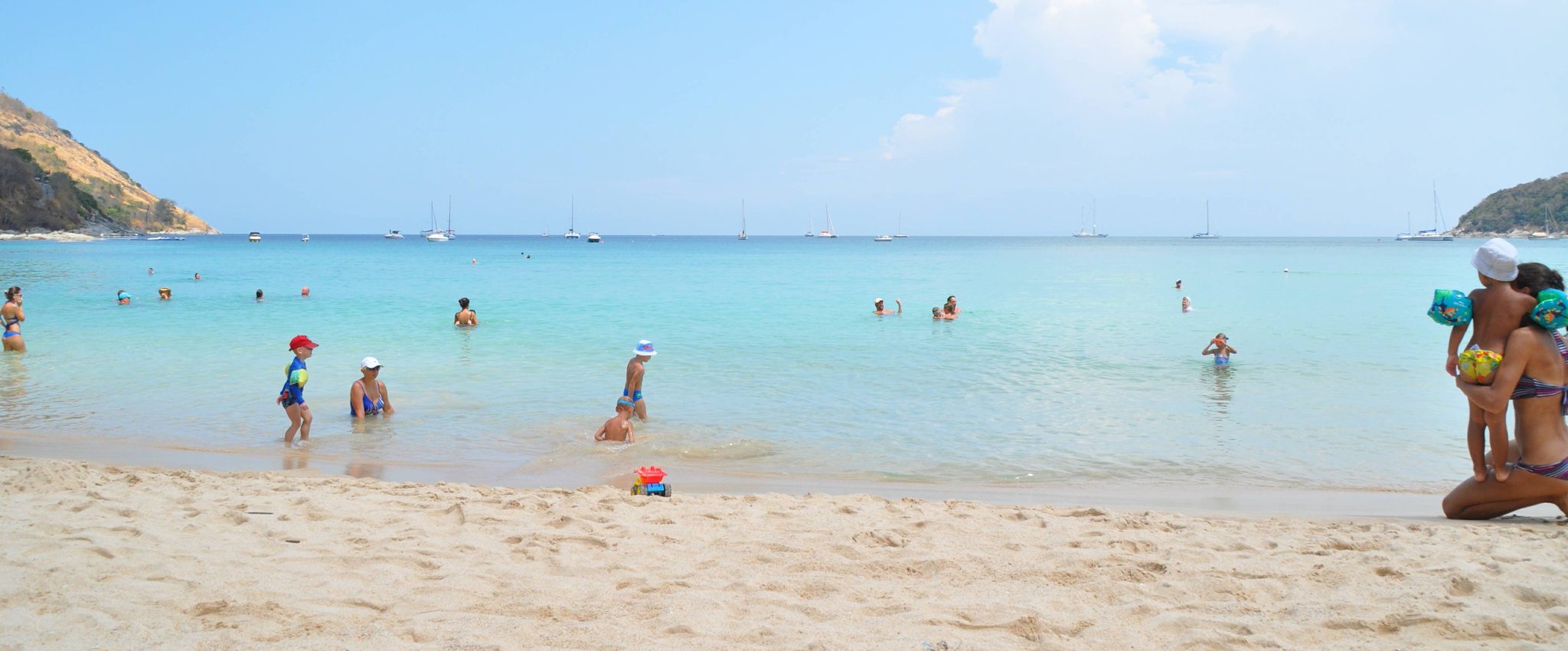 Nai Harn beach in Phuket, turquoise water and swimmers