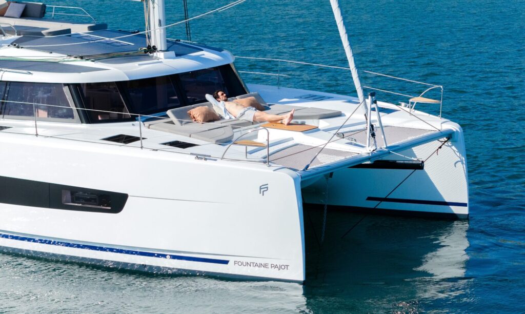 Catamaran at anchor on blue water