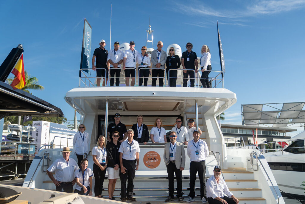 The Yacht Sales Co. team on board a yacht at a boat show
