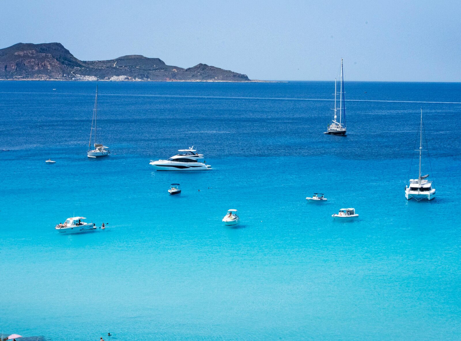 Yachts at anchor in a turquoise bay